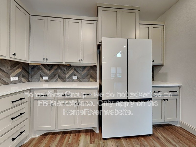 SS Appliances | Chef Kitchen | Solid Surface Flooring | Frisco ISD property image