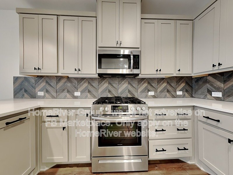 SS Appliances | Chef Kitchen | Solid Surface Flooring | Frisco ISD property image